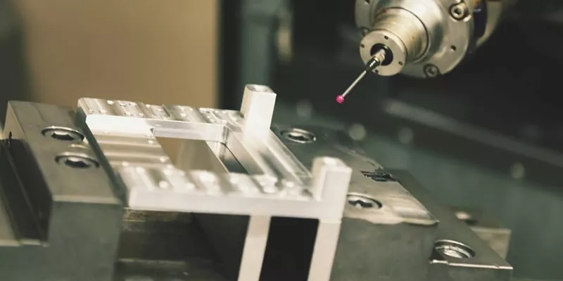 CNC machine vise holding a block part with parallels